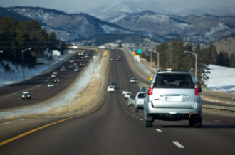 Rocky Mountain morning drive headed west on I-70 from Denver toward continental divide