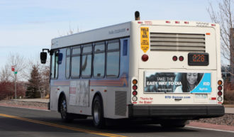 RTD bus pulled over during the daytime