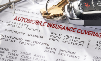 Car keys with Automobile insurance coverage document