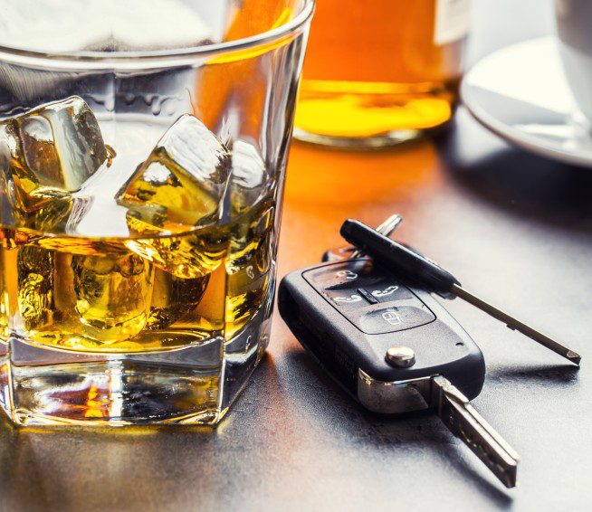 whiskey next to car keys