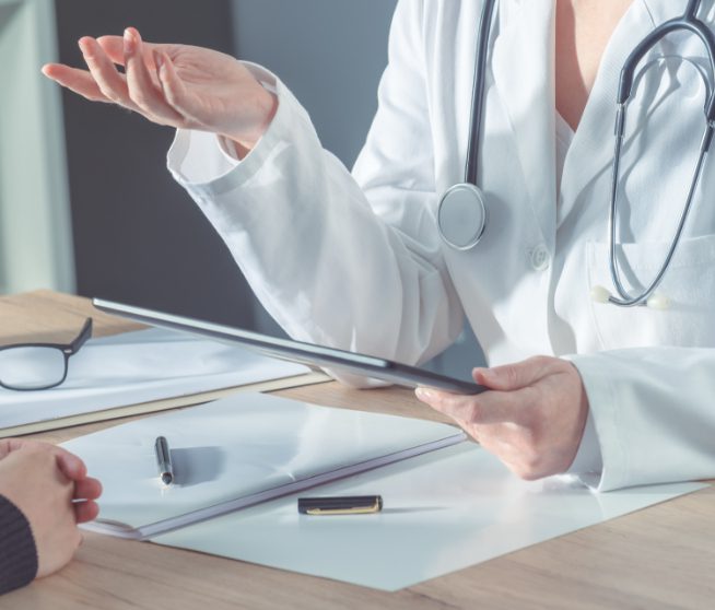 Doctor giving patient directions on how to proceed with their injury. How following the doctors recommendations will benefit you during a personal injury claim.