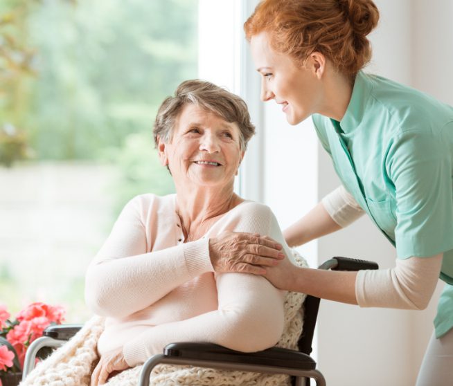 Elderly woman greeting her caregiver. How to report nursing home abuse in Colorado.