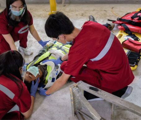 EMT's applying a c-spine to a victim during SCI awareness month.