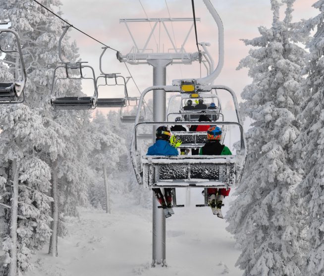 a group of people on a ski lift