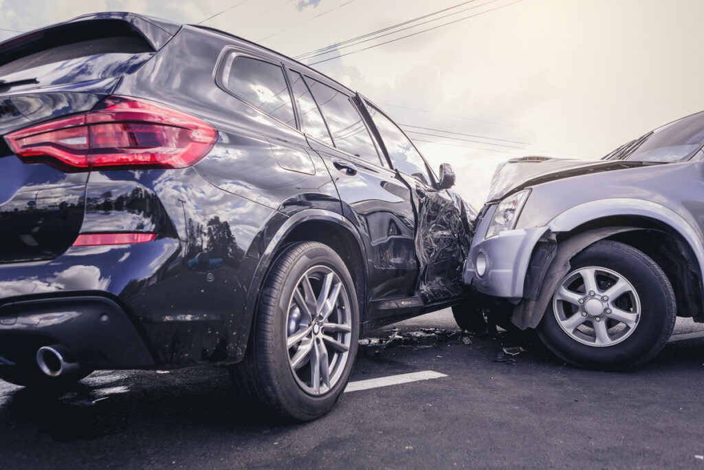 Car crash dangerous accident on the road. SUV car crashing besid