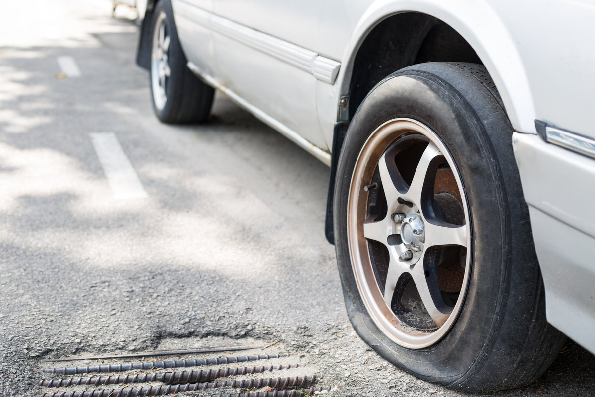 Close up Flat tire on the road waiting for repair
