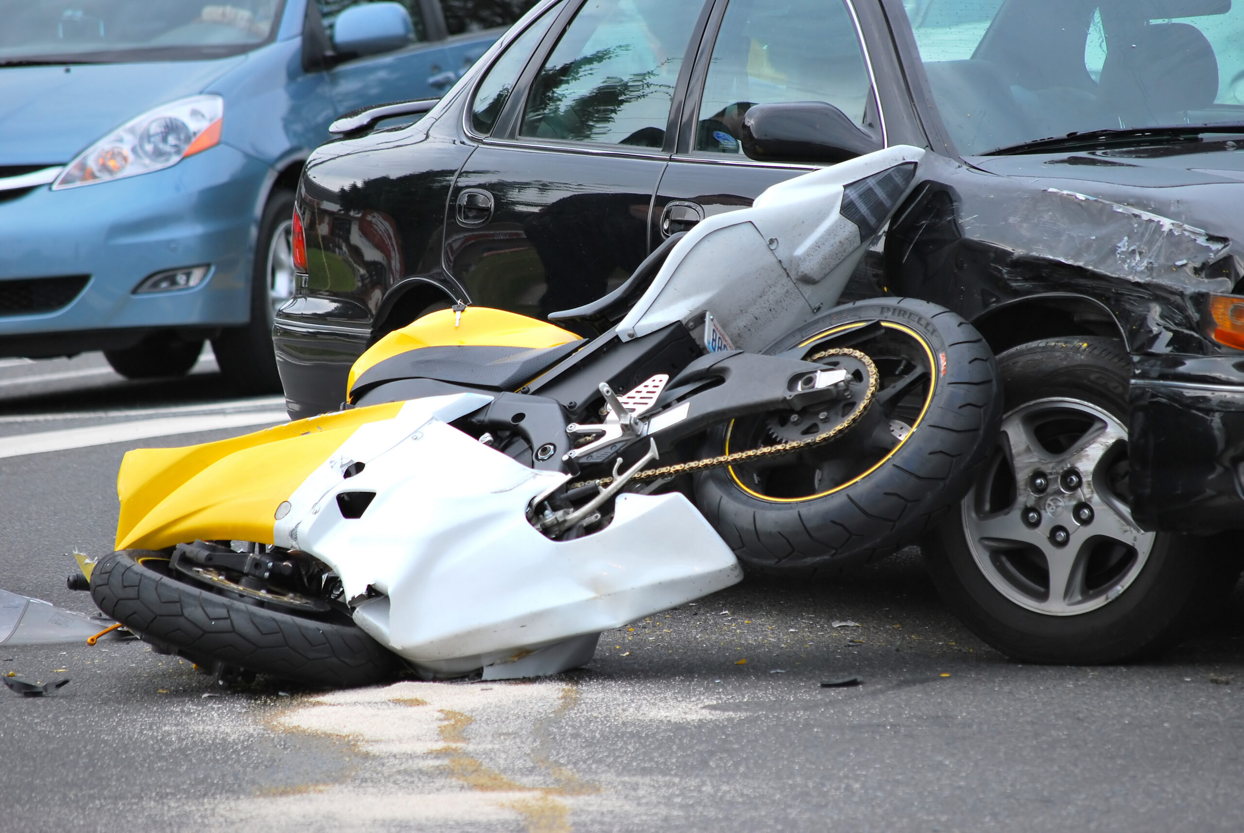 Car and motorcycle accident outdoors