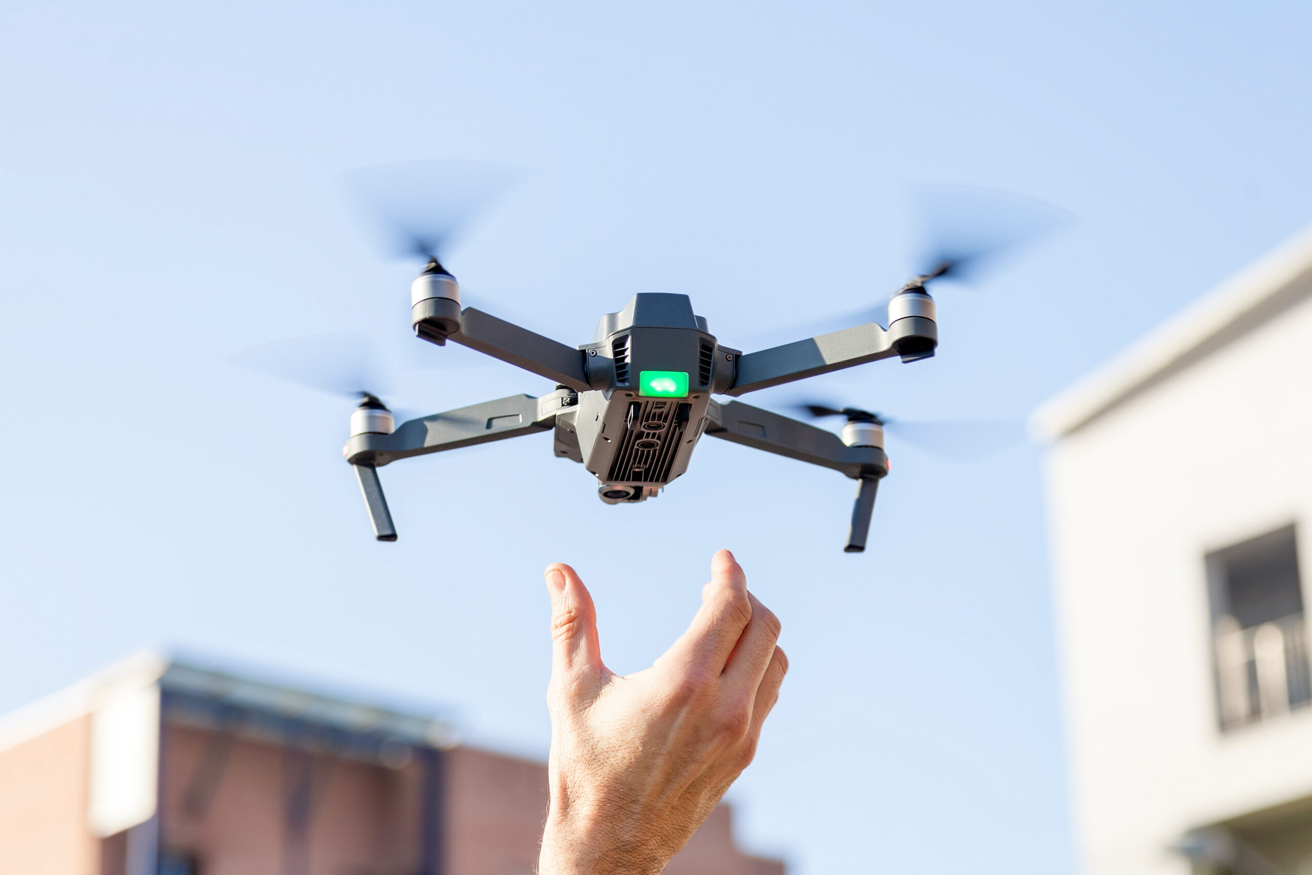Drone flying over a city skyline Drone flying over a city skyline